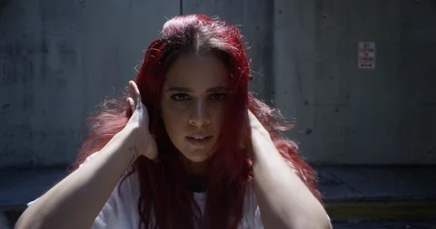 Female dancer performing her routine under an overpass Stock Footage 97033438