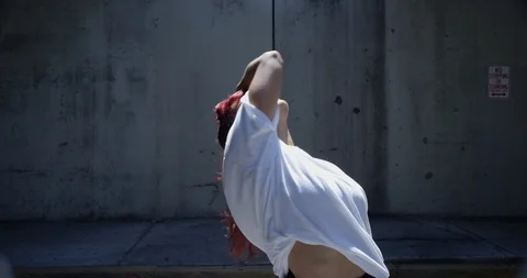 Female dancer performing her routine under an overpass Stock Footage 97035106