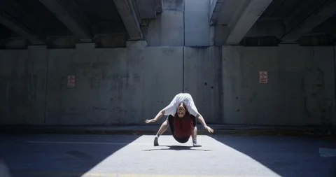 Female dancer performing her routine under an overpass Stock Footage 97036063