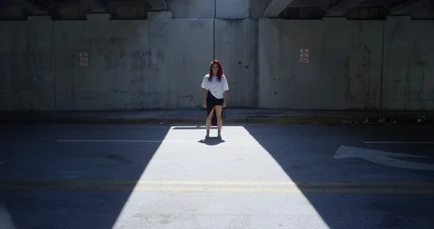 Female dancer performing her routine under an overpass Stock Footage 97036136