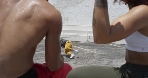 Female dancer performing her routine on top of a parking garage Stock Footage 97238515