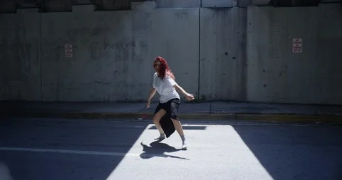 Female dancer performing her routine under an overpass Stock Footage 97239169