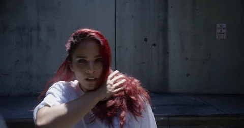 Female dancer performing her routine under an overpass Stock Footage 97385129