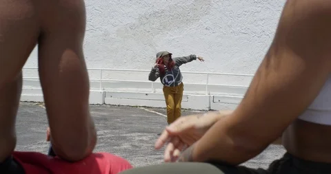 Female dancer performing her routine on top of a parking garage Stock Footage 97448439