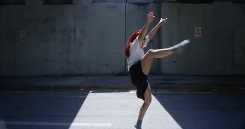 Female dancer performing her routine under an overpass Stock Footage 97450033