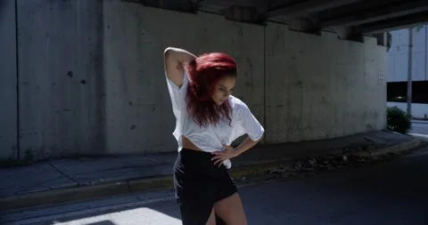 Female dancer performing her routine under an overpass Stock Footage 97450430