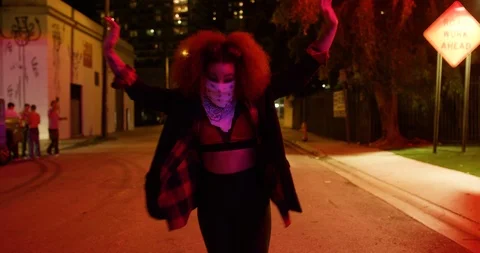 Female dancer performing her routine under an overpass at night Stock Footage 100182152