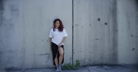 Female dancer posing against a wall Stock Footage 97455837