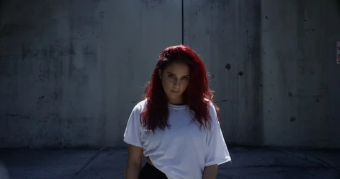Female dancer posing under an overpass Stock Footage 97035846