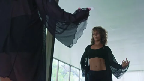 Female dancer trains in studio, learns moves and dance routine looking in mirror Stock Footage 244871731