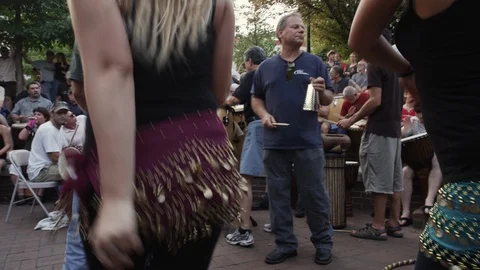 Female dancers dancing at Drum circle held Friday evenings in downtown Asheville Stock Footage 103423703