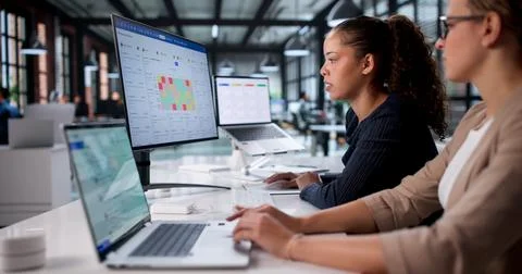 Female Data Analyst Analyzing Heatmap On Laptop In Office Setting. Stock Photos