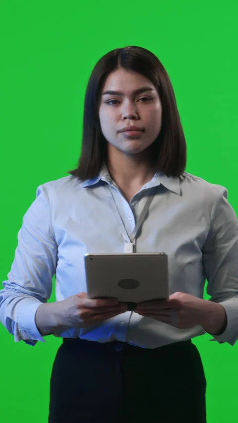 Female Data Center Engineer Posing with Digital Tablet on Green Background Stock Footage 269347997