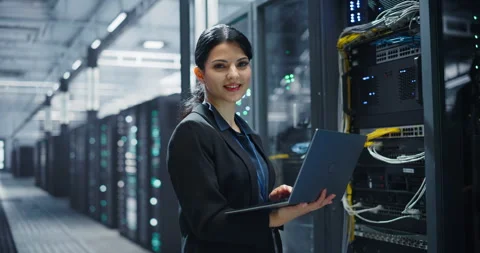 Female Data Center Engineer Using Laptop Computer Video stock 320867166