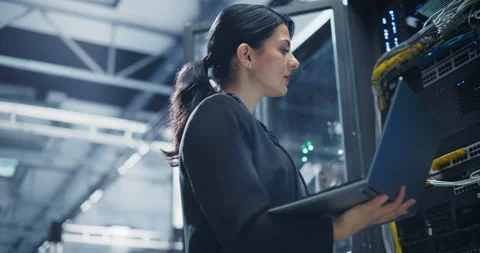 Female Data Center Engineer Using Laptop Computer Stock Footage 320867265