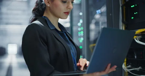 Female Data Center Engineer Using Laptop Computer Stock Footage 320867273