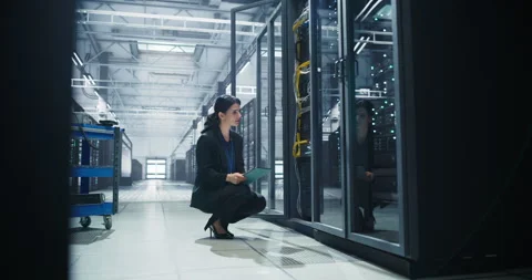 Female Data Center Specialist Using Tablet Computer 動画素材 320866203