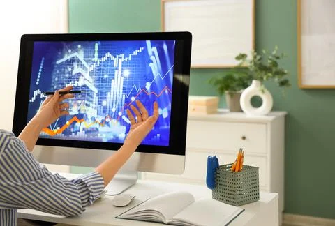 Female data scientist working with computer at desk in office 写真素材