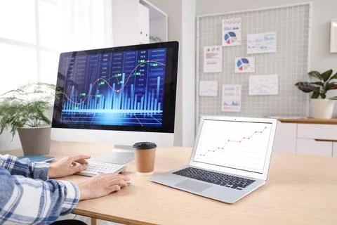 Female data scientist working with computer at desk in office 写真素材