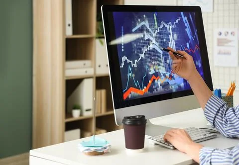Female data scientist's hands working at desk in office Stock Photos