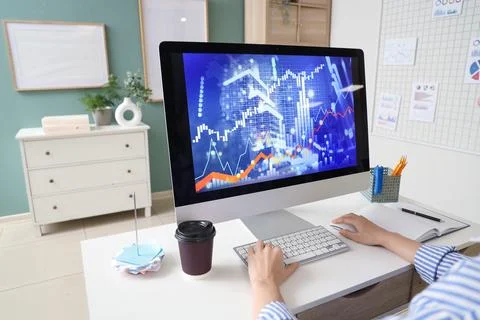 Female data scientist's hands working at desk in office Foto stock