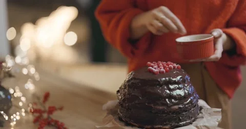 Female decorating a chocolate pie, close-up Stock Footage 145983053