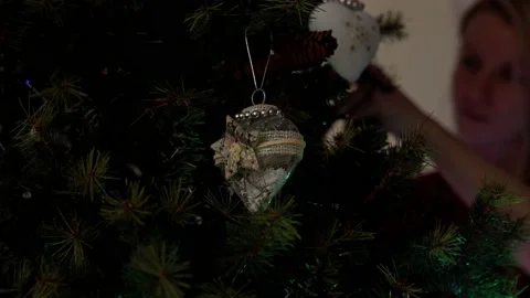Female decorating Christmas tree Stock Footage 219317331