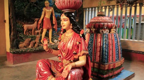 A female deity in a Hindu temple.  Smooth walking shot. Stock Footage 37933053