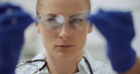 Female dentist checking dental instruments at dental clinic Stock Footage 125489577