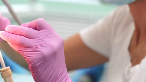 Female dentist checking up patient teeth Video stock 137403679
