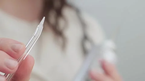 Female dentist explains how to use an oral irrigator which tips to choose and Stock Footage 307302890