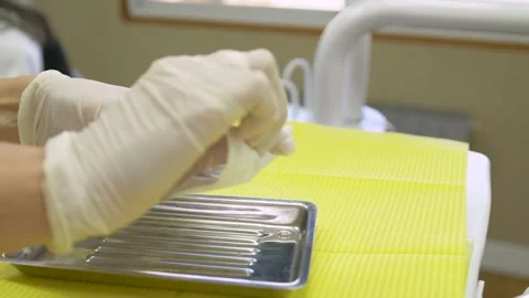Female Dentist Opening Tools Packaging Stock Footage 147980998