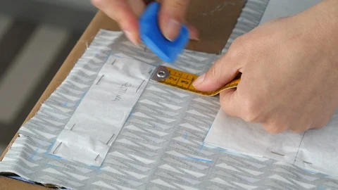 Female designer creates a template of the future dress, close up Stock Footage 90386859