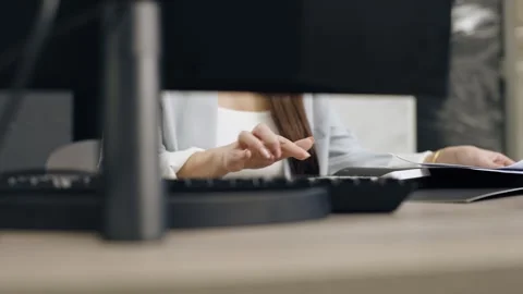 Female designer examining tile samples at desk 動画素材 274393471