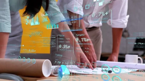 Female designer pointing at plan starting data overlay while colleague aligning Stock Footage 335466217