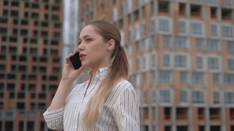 Female designer talking on the phone with a client. successful business concept Stock Footage 123469802