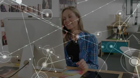 Female designer tapping tablet, HUD appearing and expanding into node network, Stock Footage 334184895