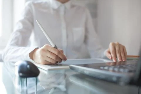 Female designer using graphics pad in office Stock Photos