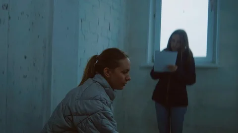 Female Designer Using Laser Measuring Tool while Working with Colleague Stockbeeldmateriaal 101368555