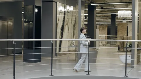 Female designer walking through tile salon Stock-Footage 276620751
