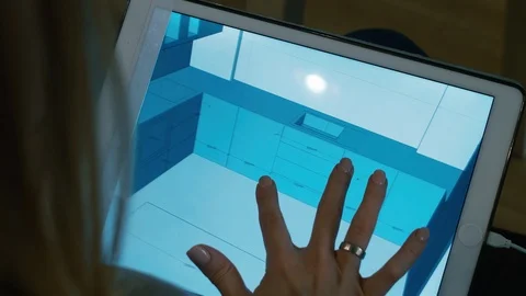 Female Designer Watching 3D Interior Model on Digital Tablet Vidéo 101367942