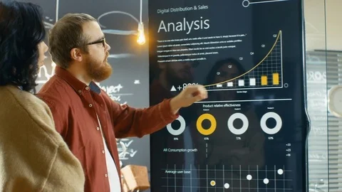 Female Developer and Male Statistician Use Interactive Whiteboard Presentation Stock Footage 82937576