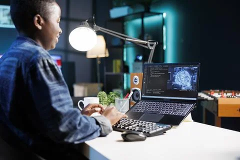 Female developer coding on laptop Stockfoto's