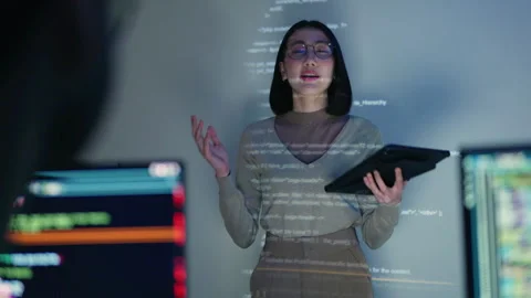 Female Developer Leading a Coding Workshop with HTML Code Projection. Stock Footage 300247079