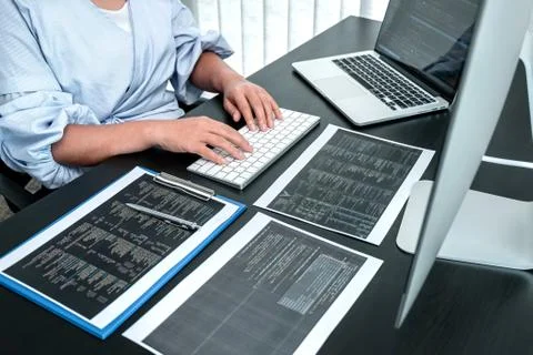 Female Developer programmer working on coding program software computer, Writ Stock Photos