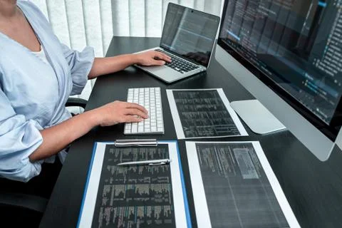 Female Developer programmer working on coding program software computer, Writ Stock Photos
