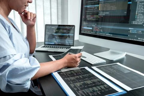 Female Developer programmer working on coding program software computer, Writ Stock Photos