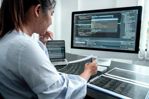 Female Developer programmer working on coding program software computer, Writ Stock Photos