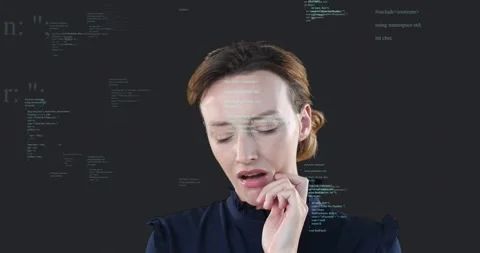 Female developer sensing jaw discomfort raising hand and massaging cheek while Stock Footage 320088952