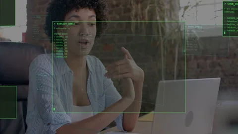 Female developer starting laptop demo, speaking and gesturing while green HUD Stock Footage 333062164